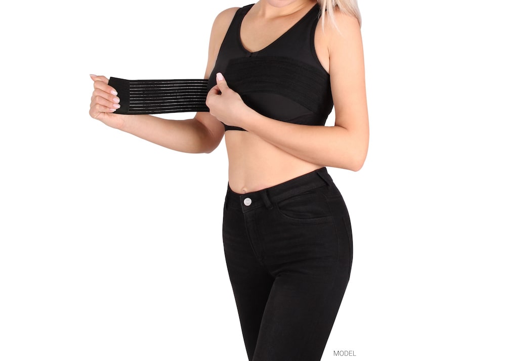 Woman wearing a surgical support bra.